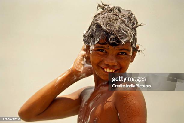 Boy having bath, Haridwar, Uttaranchal, Uttarakhand India.