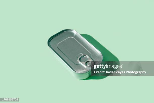 tuna tin can on green background - sardine bildbanksfoton och bilder