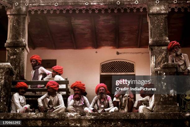 Old men watching dancers, post-Holi fair, Desuri, Rajasthan, India.