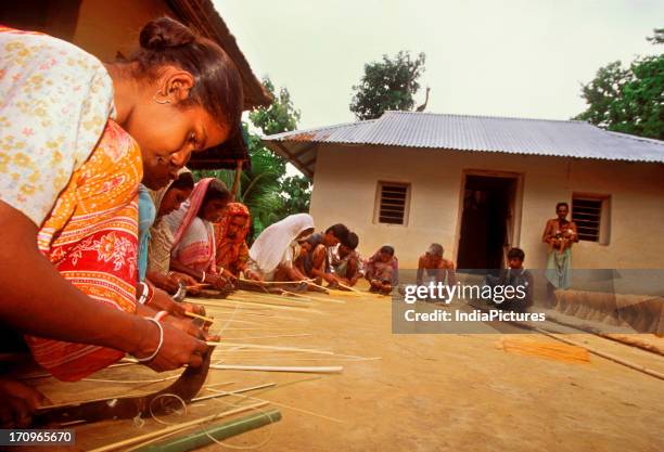 Tribal women engaged in handicraft in Tripura, India.