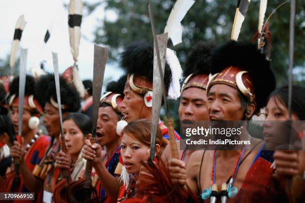 Naga men and women in their traditional attire of Nagaland, North-East India.