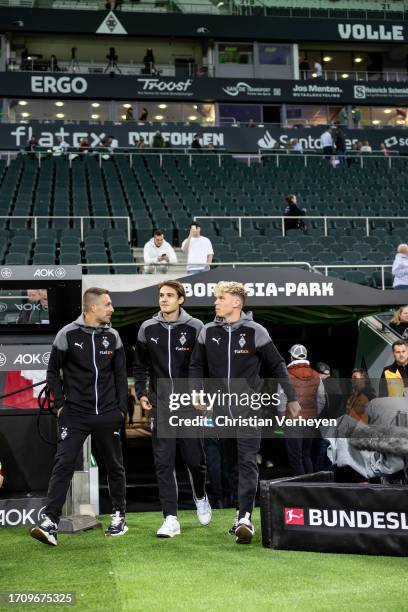 Florian Neuhaus, Robin Hack and Patrick Herrmann of Borussia Moenchengladbach are entering the pitch at Borussia-Park ahead of the Bundesliga match...