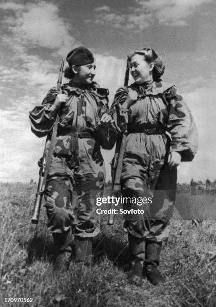 World war 2, volunteer snipers r, skrypnikova and o, bykova returning from a combat assignment.