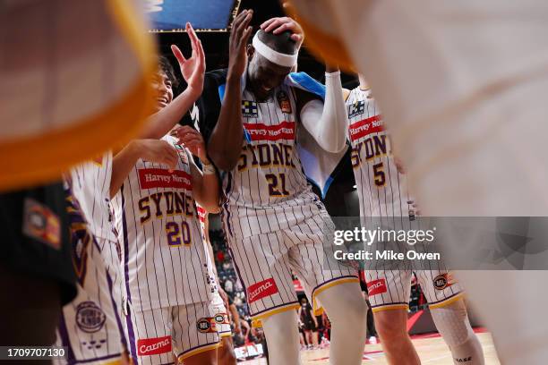 Kouat Noi of the Kings celebrates with teammates after the team's victory in the round one NBL match between Illawarra Hawks and Sydney Kings at WIN...