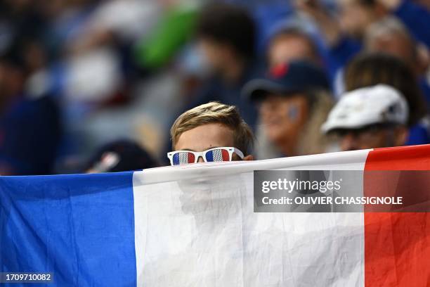 France supporter holds the national flag of France in the stands ahead of the France 2023 Rugby World Cup Pool A match between France and Italy at...