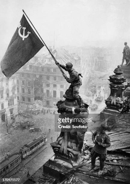 Red army soldiers raising the soviet flag over the reichstag in berlin, germany, april 30 photo taken by vladimir grebnev.