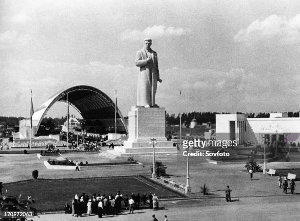 Monument to joseph stalin in front of the mechanization pavillion of the all-union agricultural exhibit in moscow, 1941.