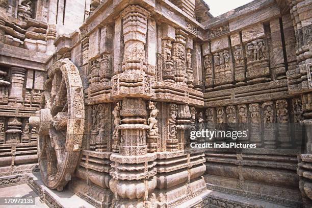 Chariot wheel and sculptures at Konark Sun Temple complex, Konark, Puri, Orissa, India.