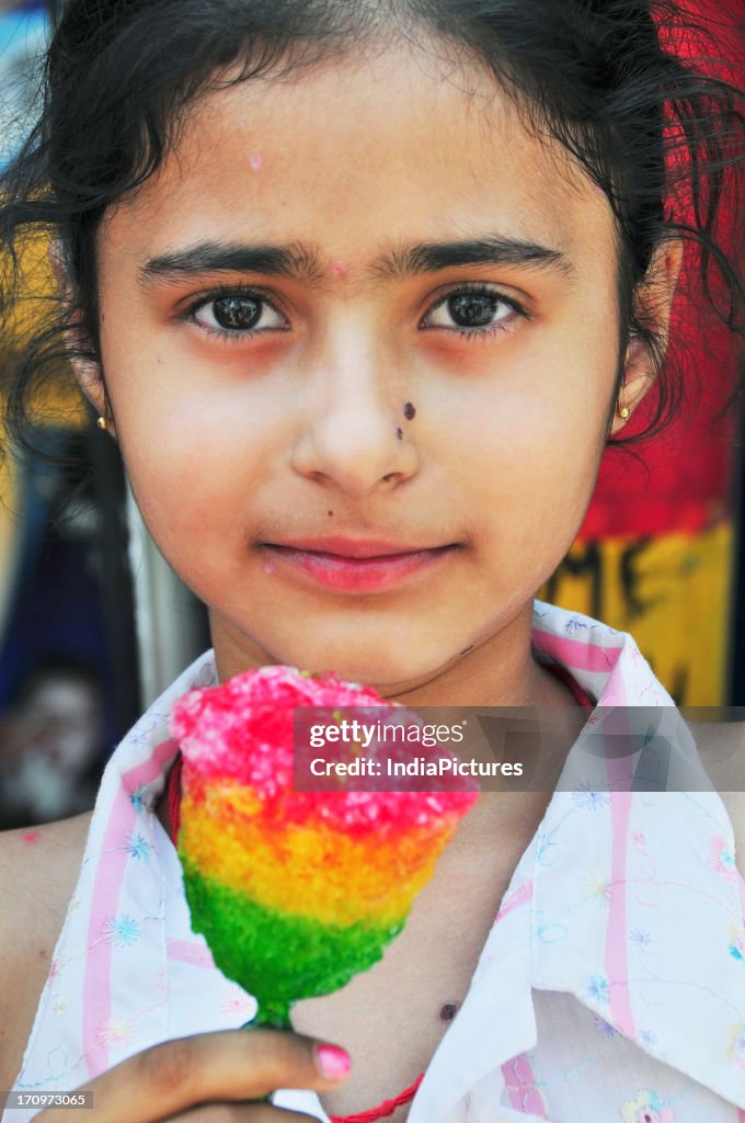 Girl holding a lolly stick