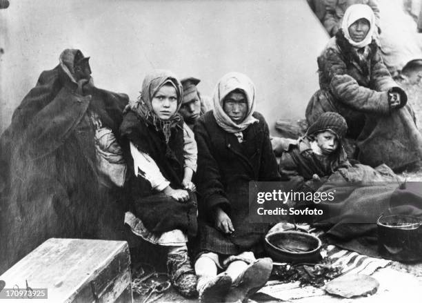 Starving chuvash family near their tent, samara, soviet union, 1921-22, famine.