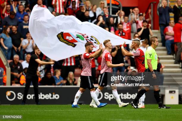 Adam Armstrong of Southampton celebrates with Carlos Alcaraz after scoring his second goal of the game during the Sky Bet Championship match between...