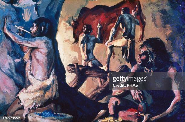 Prehistory. Upper Paleolithic. Homo Sapiens painting a bison during a ritual ceremony inside a cave.