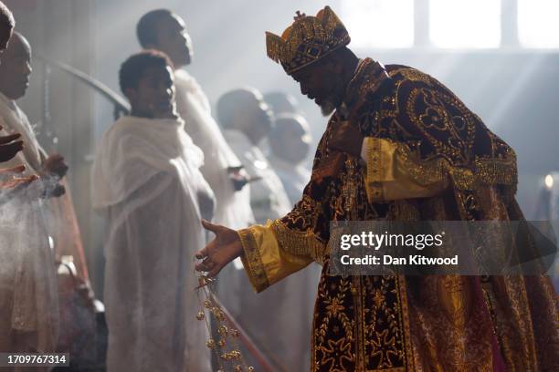 Members of the Ethiopian community take part in a joint celebration of Meskel, and the restitution of a sacred Tabot, at the Ethiopian Orthodox...