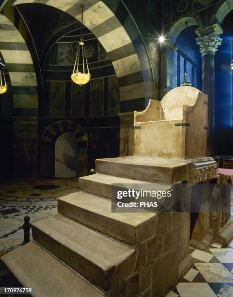 Throne of Charlemagne. C.800. Marble. West side of the upper gallery. Palatine Chapel. Aachen Cathedral. Germany.