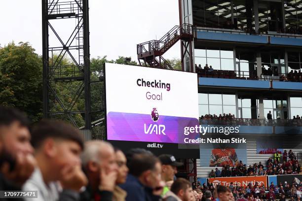 General view of the scoreboard as the VAR review the goal scored by Ansu Fati of Brighton & Hove Albion for a possible offside during the Premier...