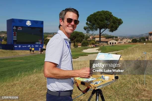 Artist Lee Wybranski paints a picture of the 15th hole during the Saturday afternoon fourball matches of the 2023 Ryder Cup at Marco Simone Golf Club...