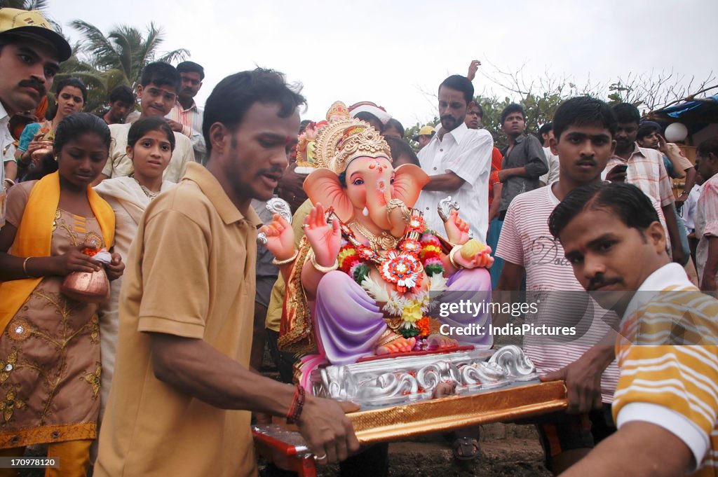Devotees carrying a Ganesh idol