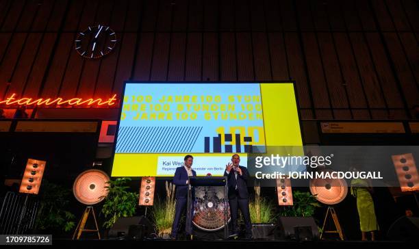 Berlin Mayor Kai Wegner and Managing Director of the Tempelhof Project Fabian Schmitz-Grethlein address guests at the opening ceremony of the "100...