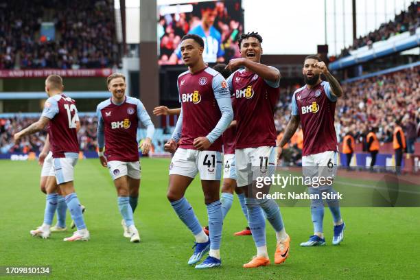 Jacob Ramsey of Aston Villa celebrates with Ollie Watkins of Aston Villa after scoring the team's fifth goal during the Premier League match between...