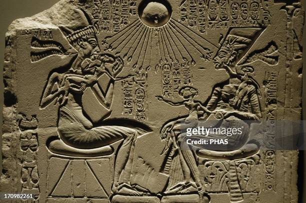 Egyptian art. A house altar depicting Akhenaten, Nefertiti and three of their Daughters. Relief. Limestone. New Kingdom. Amarna period. 18th dynasty....