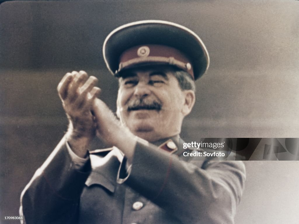 Joseph stalin applauding the red army during a may day parade in red square in 1949.