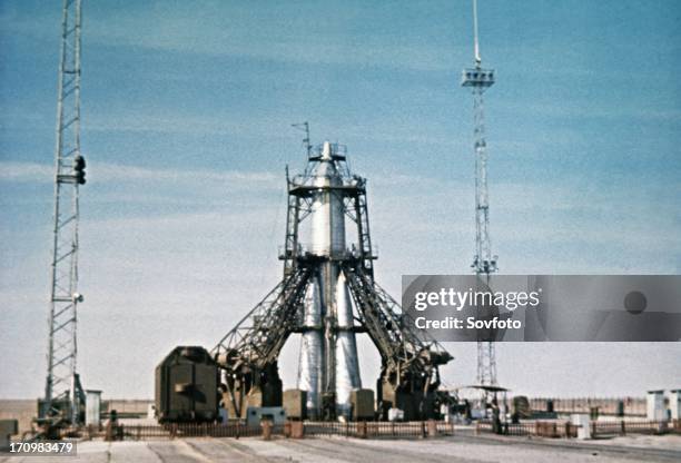 Vostok rocket carrying the sputnik 1 satellite on the launch pad in 1957, this is a still from a soviet film of the launch.