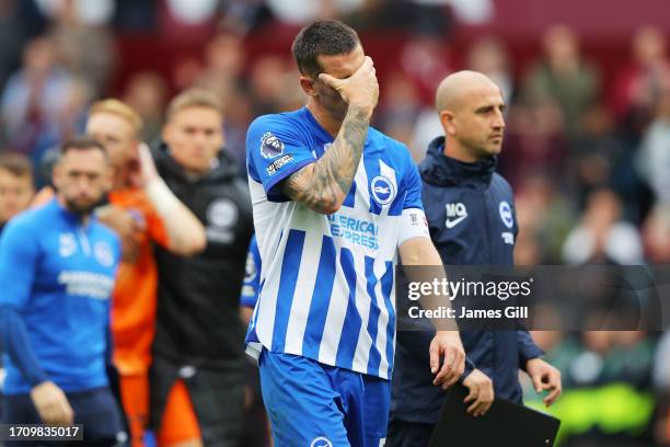 Lewis Dunk of Brighton & Hove Albion looks dejected at full-time following the Premier League match between Aston Villa and Brighton & Hove Albion at...