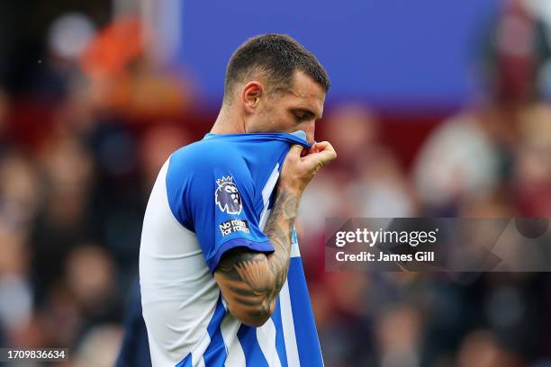 Lewis Dunk of Brighton & Hove Albion looks dejected at full-time following the Premier League match between Aston Villa and Brighton & Hove Albion at...