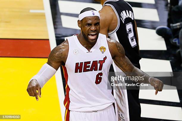 LeBron James of the Miami Heat reacts in the third quarter while taking on the San Antonio Spurs during Game Seven of the 2013 NBA Finals at...