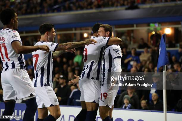 John Swift of West Bromwich Albion celebrates after scoring a goal to make it 0-1 with Grady Diangana of West Bromwich Albion, Alex Mowatt of West...