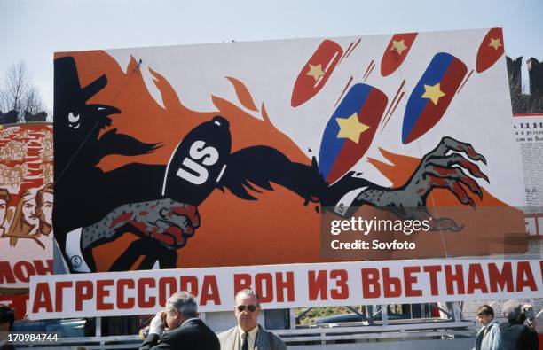 Aggressors out of vietnam!' reads a cold war era billboard on a moscow street showing bombs raining down on uncle sam , may 1, 1968.