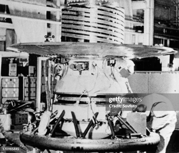 The descent capsule of the soviet space probe venera 9 being worked on in the assembly shop,1975.