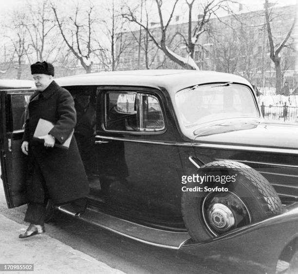 Vyacheslav m, molotov on his way to a meeting of the moscow session of the ministers council, march 14 the car is an armored american packard.