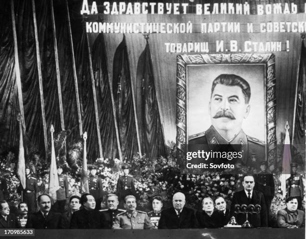 Ceremony at the bolshoi theater celebrating joseph stalin's 70th birthday, seated, from left to right, are togliatti, budenni, kaganovich, suslov,...