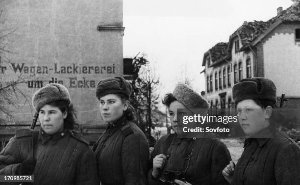 Third belorussian front, world war 2, a group of young women, red army snipers who have 2,000 german kills between them, inspecting a small town in...