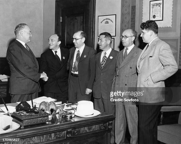 Mayor fletcher bowron of los angeles meeting with professor solomon mikhoels and lt, colonel itzik feffer, officers of the jewish anti-fascist...