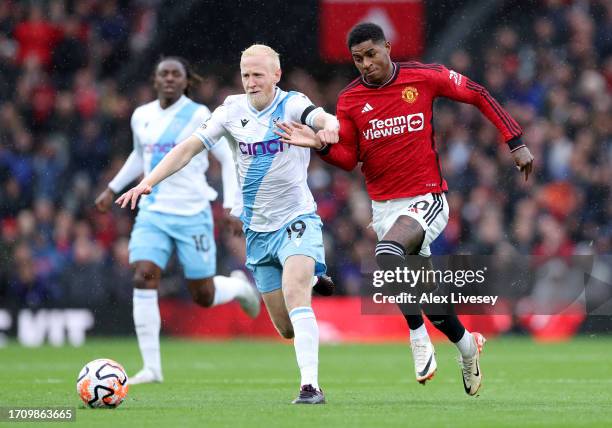 Will Hughes of Crystal Palace and Marcus Rashford of Manchester United compete for the ball during the Premier League match between Manchester United...