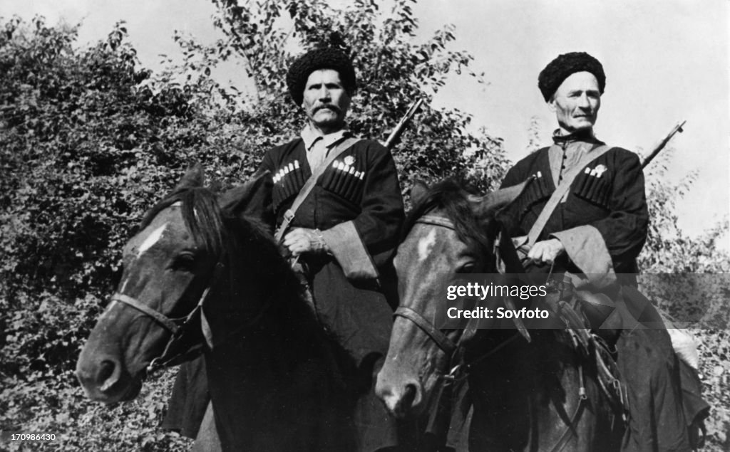 Kuban cossacks, 60 year old pavel kamnev (left) and 63 year old mikhail grachev, who volunteered for service in a cossacks' corps, in one attack, they sabered 28 german officers and men between them, northern caucasus, 1942.