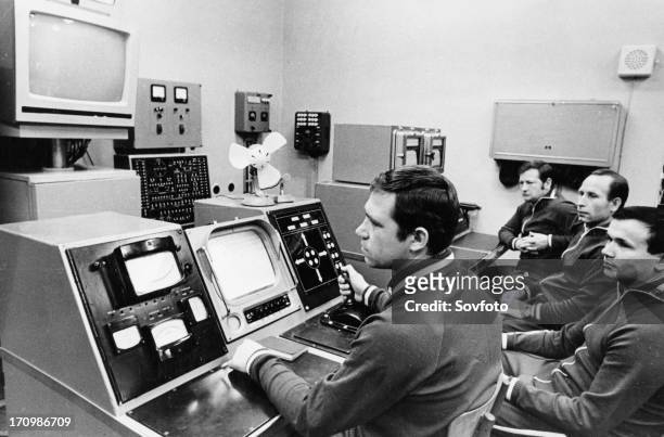 Luna 21 mission, the crew of the soviet remote-controlled lunar rover, lunokhod 2 working the controls at the distant space communications center,...