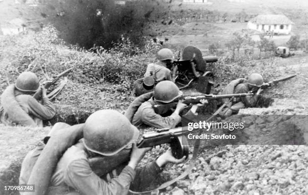 Red army men fighting for a village in the northern caucasus, 1942.