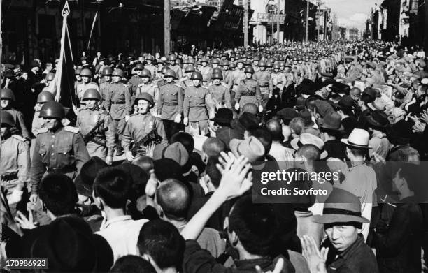 Operation august storm , population of harbin, manchuria greet victorious red army soldiers after the japanese surrendered the city on august 20th...