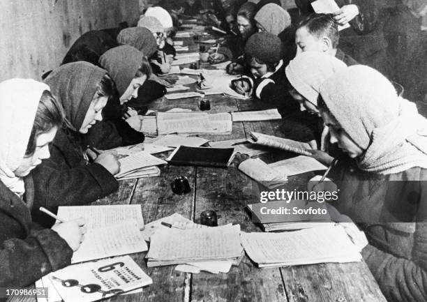 Basic literacy class given at the club of the krasny bogatyr works in moscow, 1932.