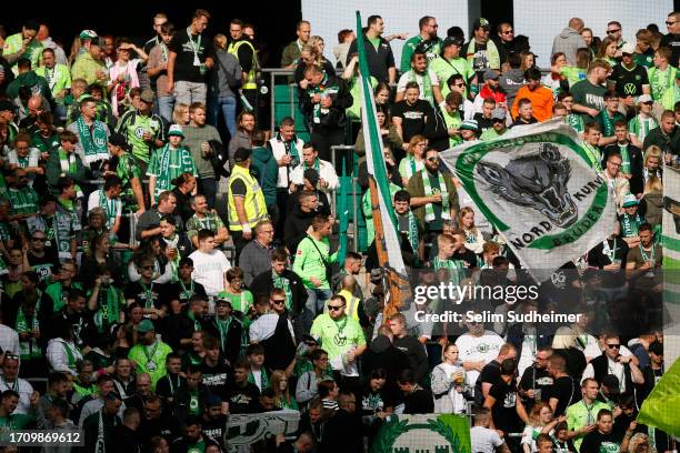 Fans of VfL Wolfsburg arrive inside the stadium prior to the Bundesliga match between VfL Wolfsburg and Eintracht Frankfurt at Volkswagen Arena on...