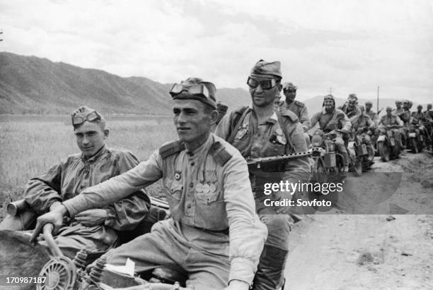 Operation august storm , a squad of motorized soviet automatic riflemen advancing across the manchurian steppes against the japanese, august 1945.