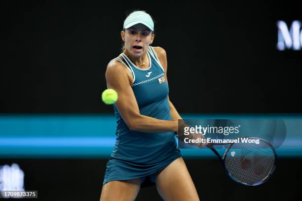 Magda Linette of Poland returns a shot against Victoria Azarenka of Belarus on day 5 of the 2023 China Open at National Tennis Center on September...