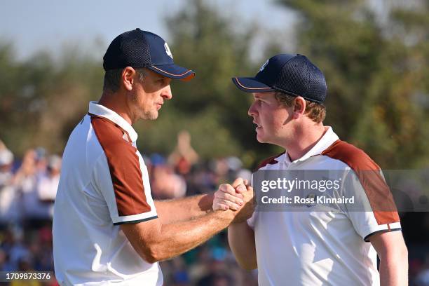 Justin Rose and Robert MacIntyre of Team Europe celebrate on the 13th green during the Saturday afternoon fourball matches of the 2023 Ryder Cup at...