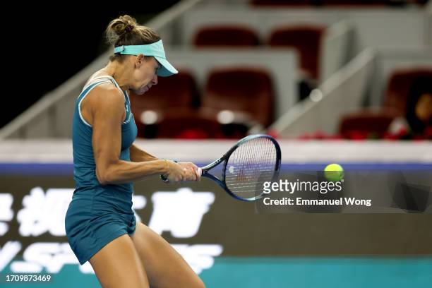 Magda Linette of Poland returns a shot against Victoria Azarenka of Belarus on day 5 of the 2023 China Open at National Tennis Center on September...