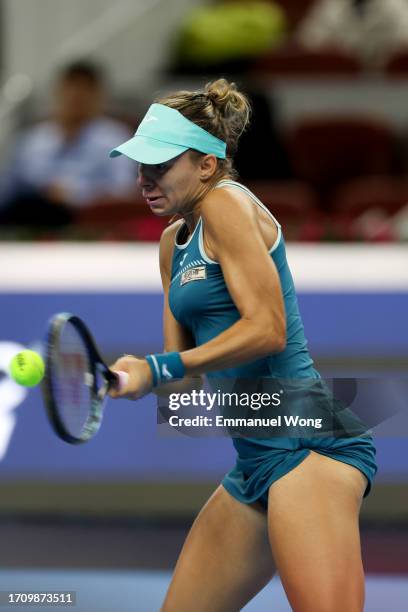 Magda Linette of Poland returns a shot against Victoria Azarenka of Belarus on day 5 of the 2023 China Open at National Tennis Center on September...