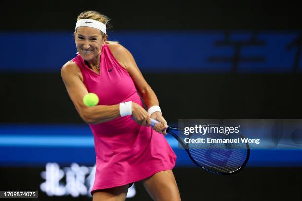 Victoria Azarenka of Belarus returns a shot against Magda Linette of Poland on day 5 of the 2023 China Open at National Tennis Center on September...