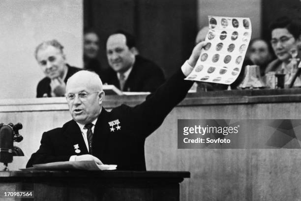 Soviet premier, nikita khrushchev, showing photographs of objects found in the u2 spy plane that was shot down over soviet territory on may 1st joint...